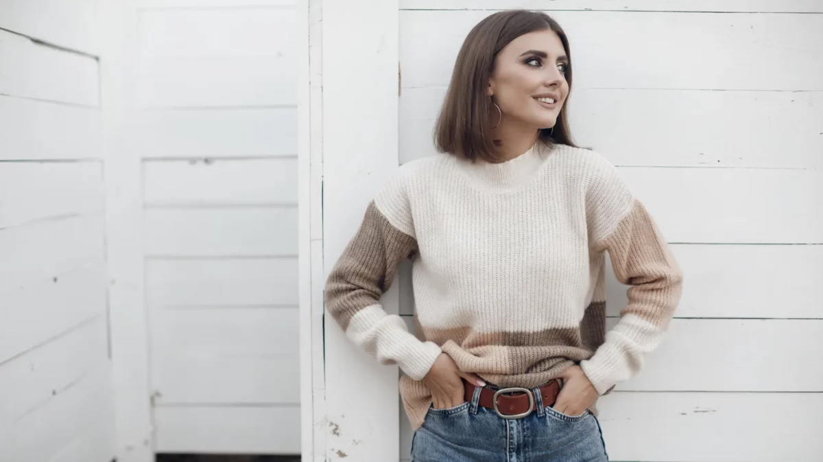 Pretty young woman outdoors wearing sweater