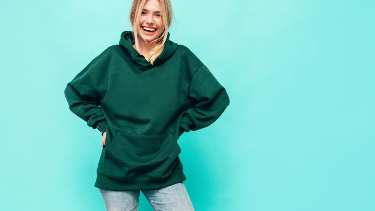 Young woman in a trendy green hoodie
