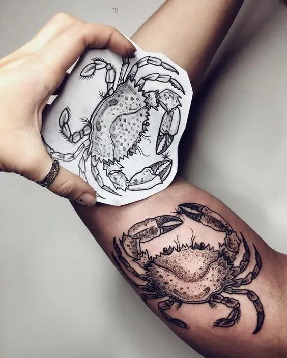 Creative tattoos are really looking beautiful. You can also look unique with this crab tattoo on your upper arm.