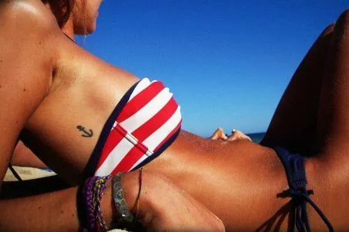 Little anchor tattoo in combination with your striped bikini would be perfect for the seaside. This is a minimal tattoo, but what a great place on your body for showing it off.