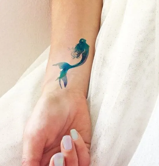 Mermaid seems very feminine, and they are a perfect idea for your summer tattoo! Let it be made of watercolors.