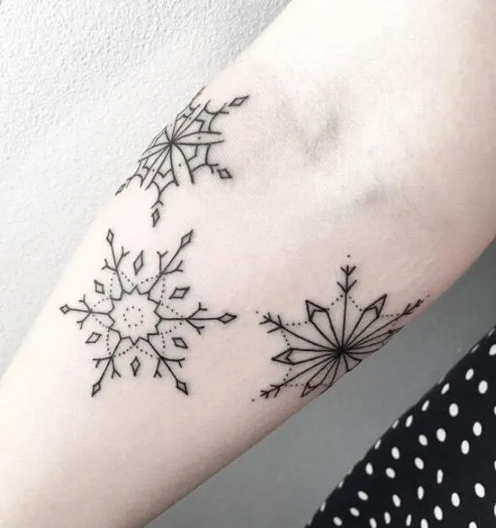 Lovely winter tattoo on the forearm