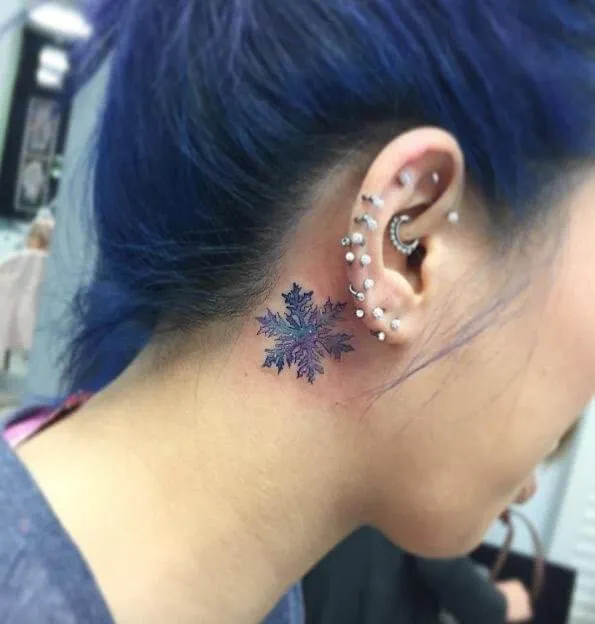 Behind the ear tattoo
