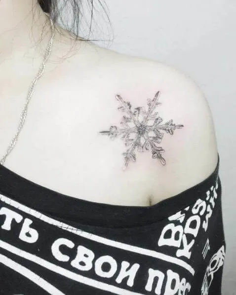 Icy snowflake on the shoulder
