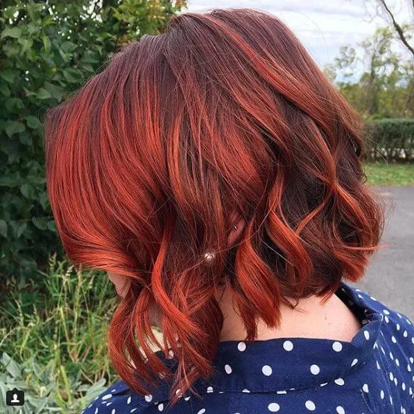 There is something retro in short red hairstyles.