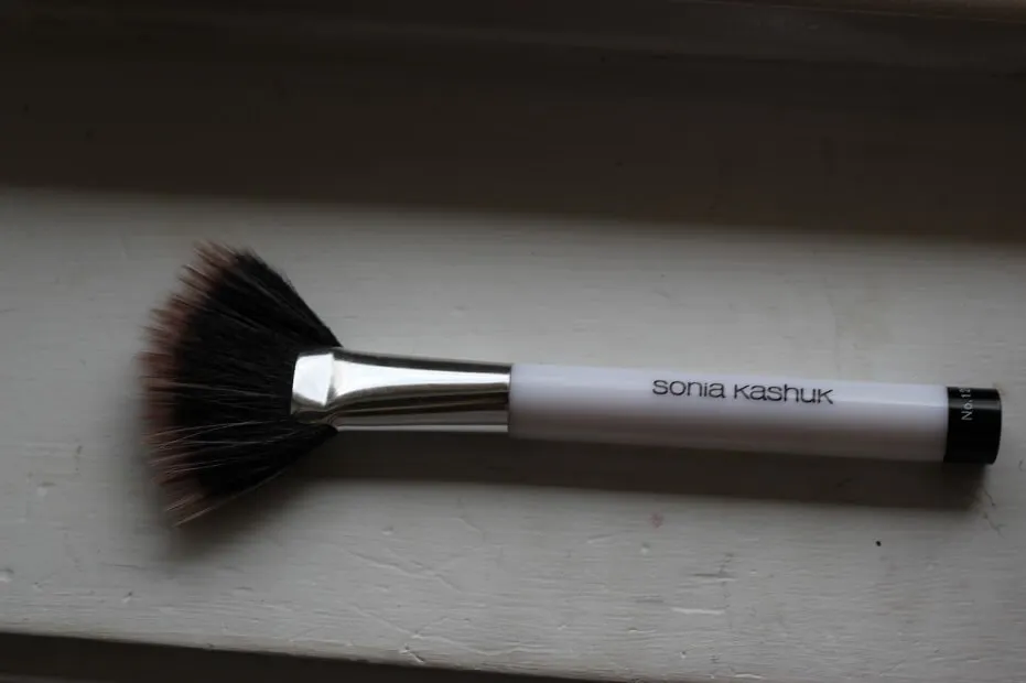 A fan brush like this one from Sonia Kashuk can double as a brush for both highlight and contour