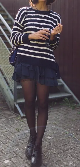 Preppies are the prettiest girls, especially when styled in classic Breton stripes and a frilly ruffled skirt. Accentuate the feminine effect with fine black hosiery and black leather brogues.