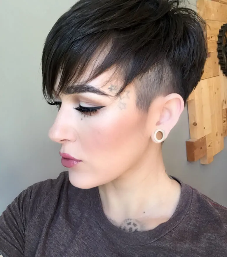 For this pixie look use a little hair gel to set the longer layers in a side sweep