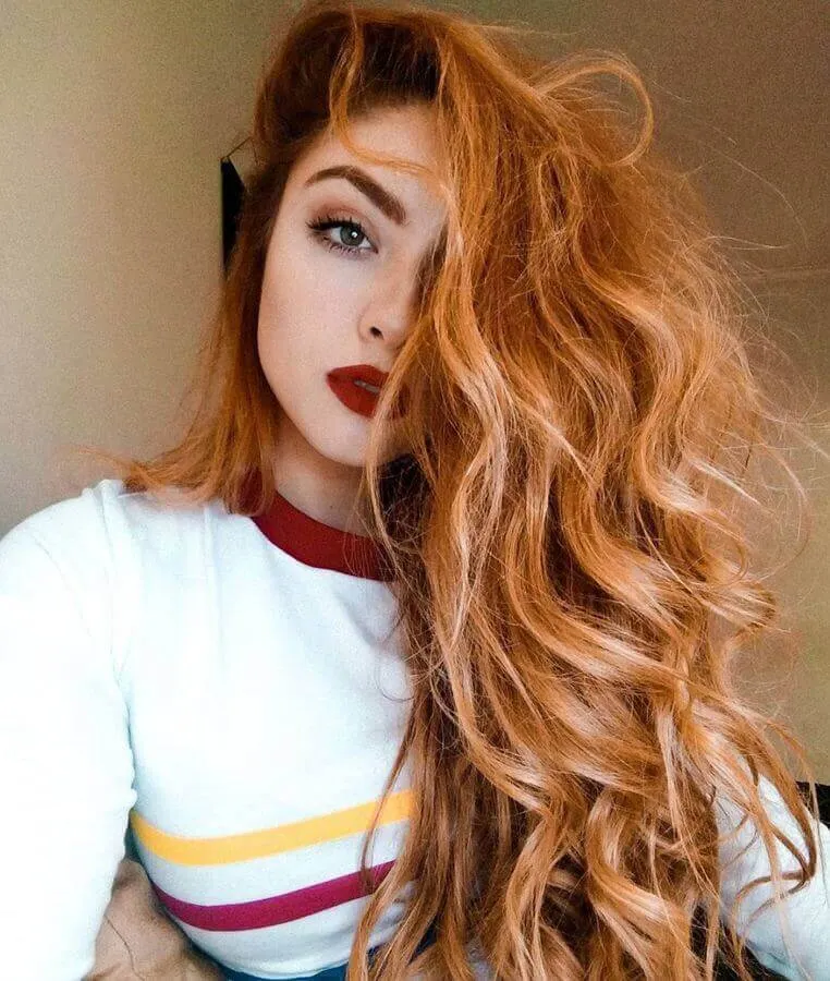 Fiery red hair looks divine with red lipstick.