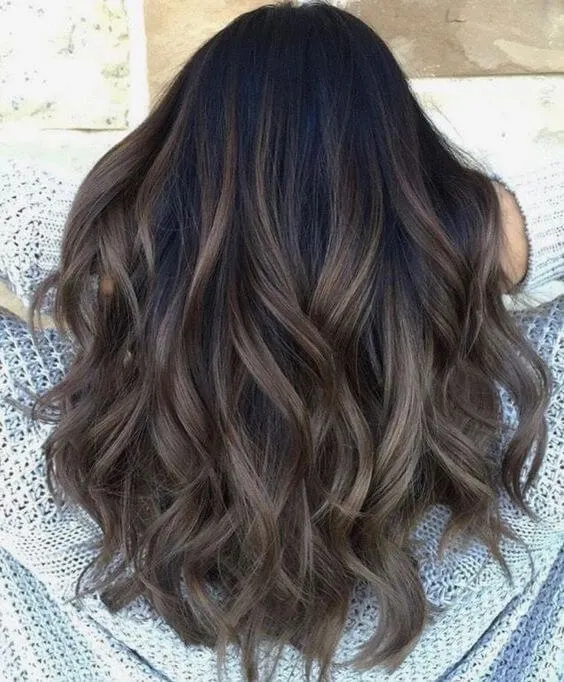 Shades of ash on the hair ends look more than fantastic. They add perfect cold vibe to your warm black hair color.