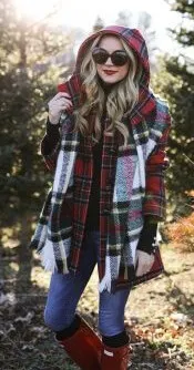 Don’t be shy to make a statement by mixing your plaid patterns. A red tartan jacket is a perfect partner to blue jeans, red boots and a black and white plaid scarf.