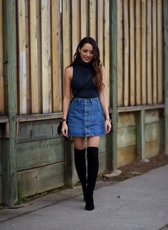 The denim skirt is one of those items that never go out of style. That is why you can wear it from early morning to the late night in the club. #cluboutfit #highboots