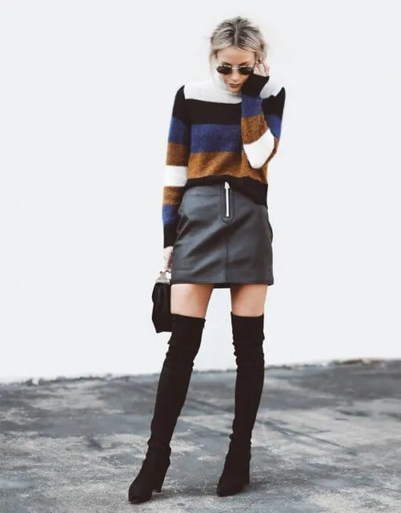 Stripes will never go out of fashion. You must have a sweater that looks like this one. Pair it with a leather skirt and thigh-high boots for ultimate club look. #cluboutfit #highboots