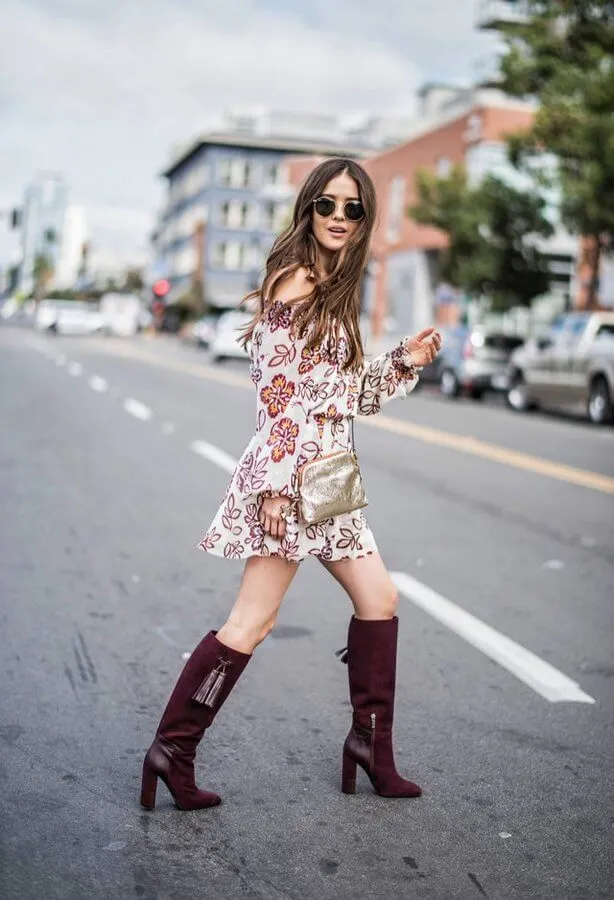 The off-the-shoulder dress looks very flowy and summerish. However, while it is still early fall, you can mix this dress with burgundy knee-high boots. These boots have block heels which automatically make them the most comfortable in the world. You can add a shiny accessory, such as a crossbody bag. #highboots