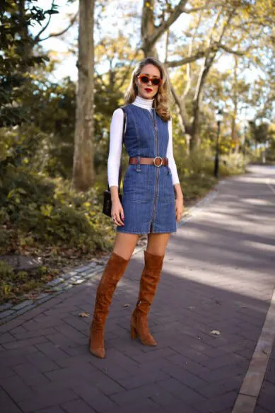 Add cowboy vibes to your daily outfits, by wearing denim dress with brown suede details. #highboots