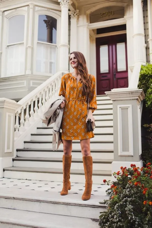 Warm orange shade is one of the best fall shades. The dress is accessorized with flowers and styled with over-the-knee boots. Perfect for sunny fall days, right? #highboots