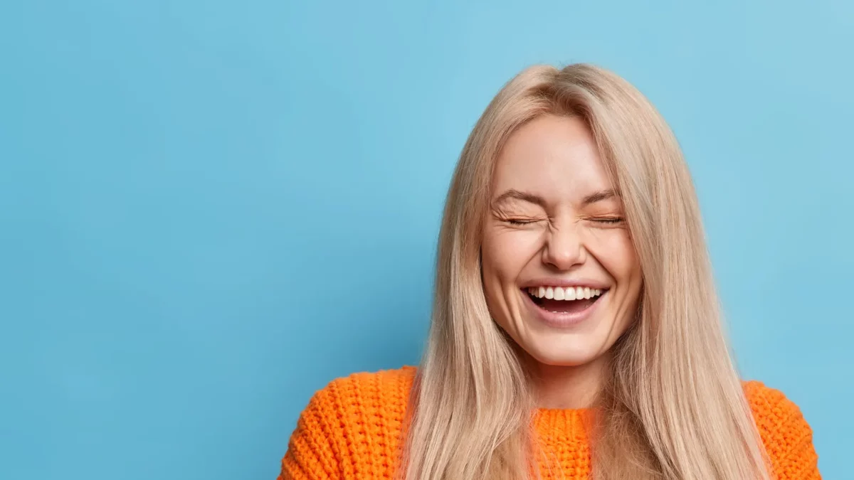 Overjoyed woman with blonde long hair