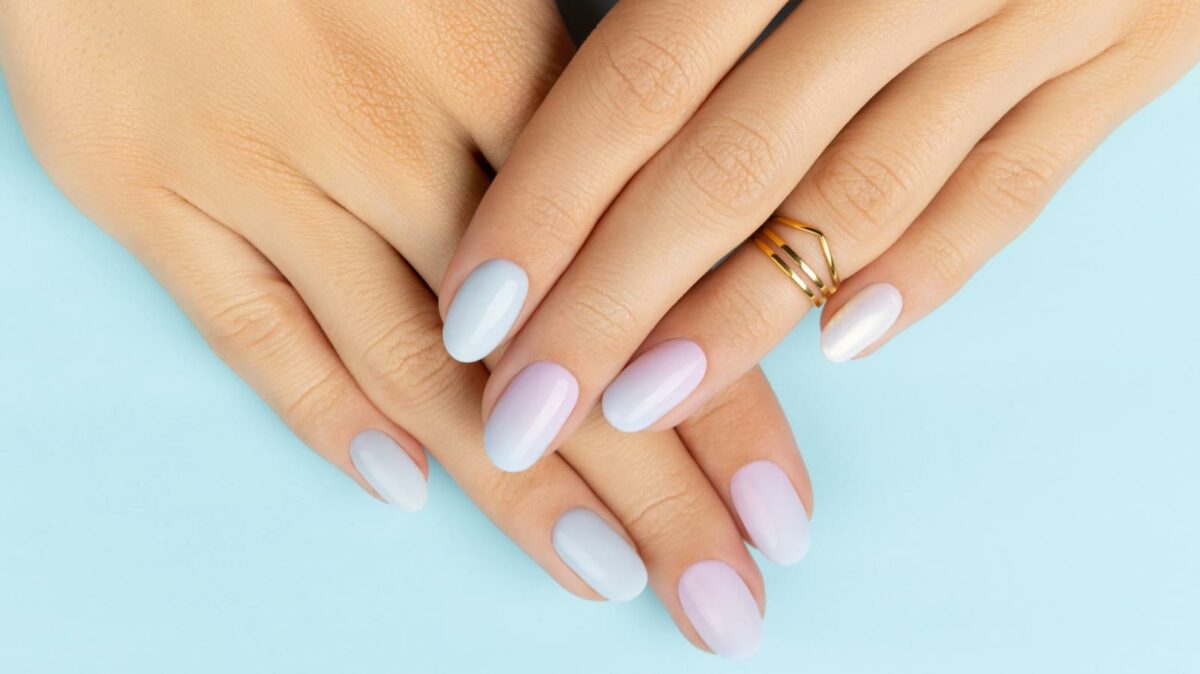 Woman's hands with trendy ombré nails