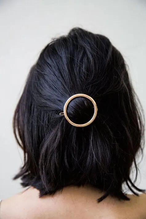 Endless way to style your hair: just try searching Etsy for an astonishing amount of amazingly creative barrettes like this round clip.