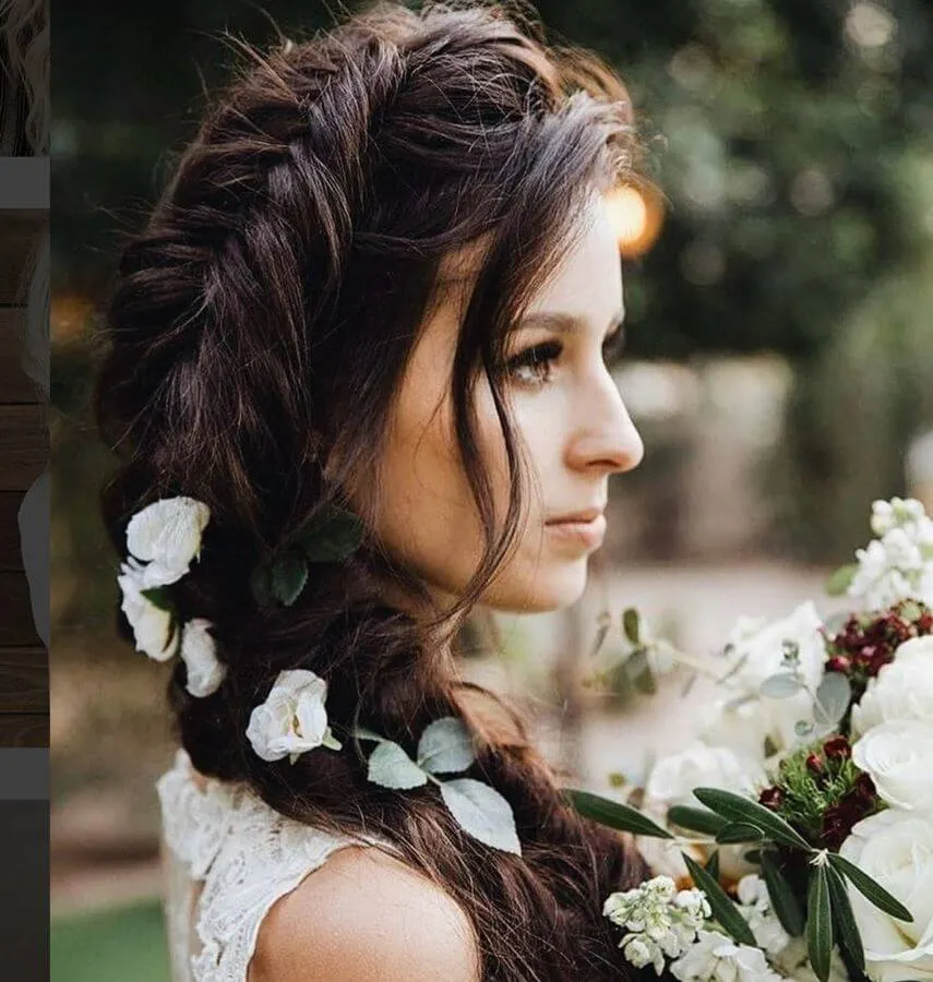For a look right out of a romantic novel, try this fish braid with flowers on your hair. Leave out loose strands of your side-swept bangs to finish the look.