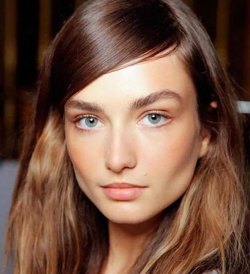 Straighten your bangs and lay them flat to add some sophistication to your look.