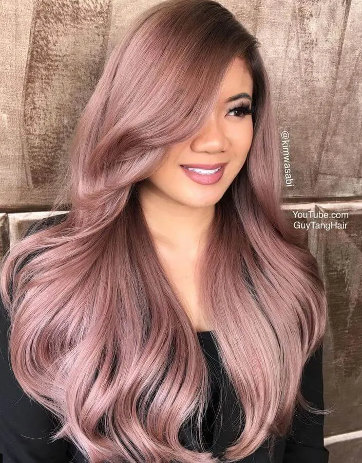 Healthy hair is happy hair, and this voluminous rose gold look with side-swept bangs is total #hairgoals!