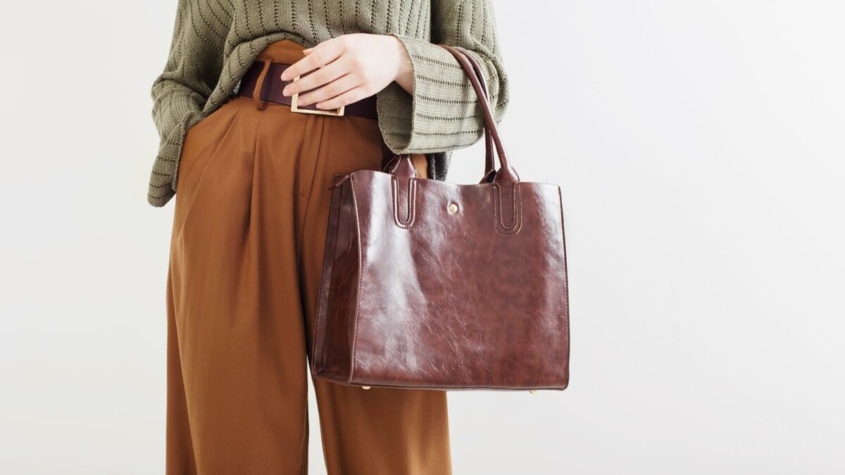 Girl in modern clothes with  handbag, palazzo pants