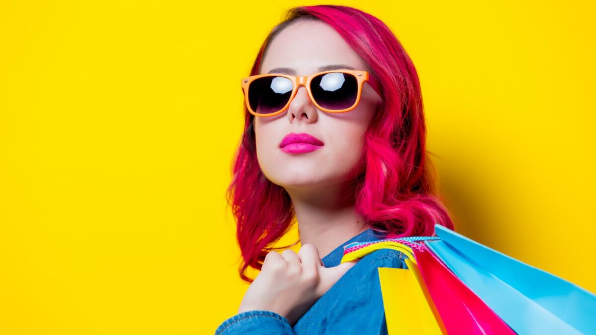 Young pink hair girl in sunglasses and blue shirt