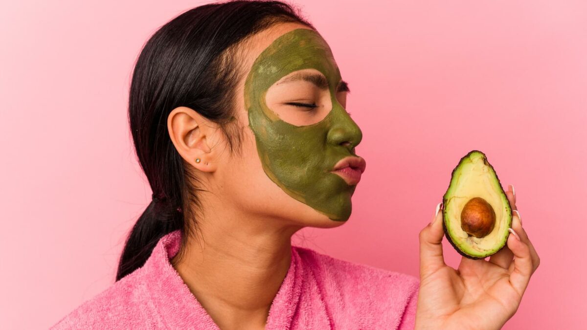 Woman wearing an avocado facial mask