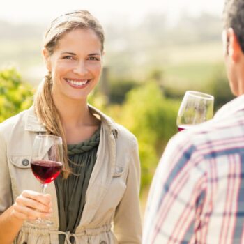 Happy couple having wine. How to dress for a winery visit?