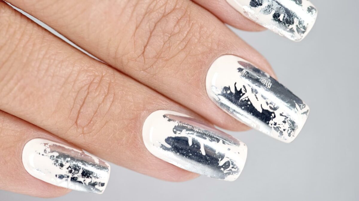 Stylish trendy female silver manicure