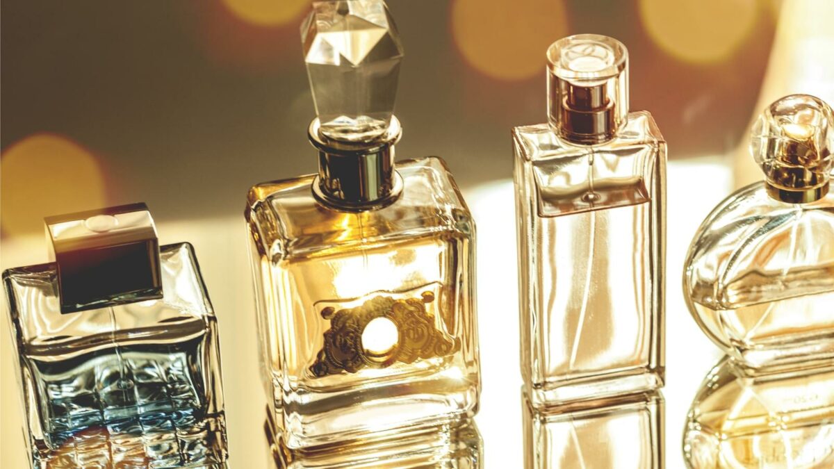 Aromatic Perfume bottles on background