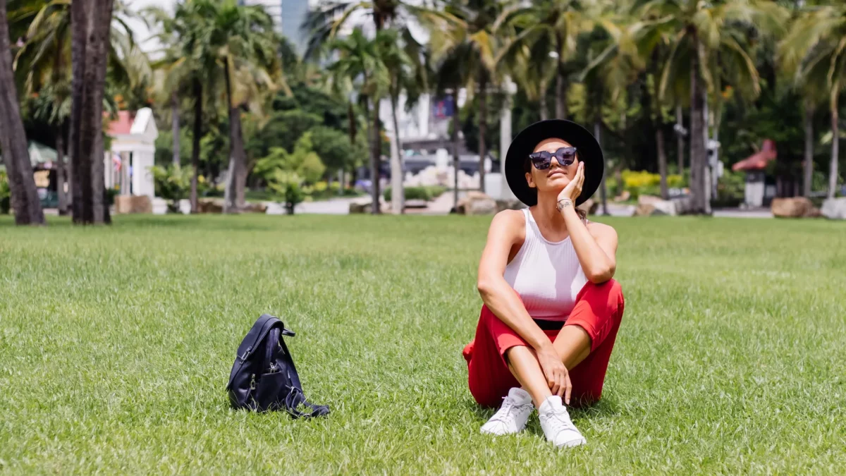 Woman in Bangkok with backpack enjoying a beautiful sunny day