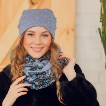 A beautiful woman wearing a knitted warm hat and a scarf
