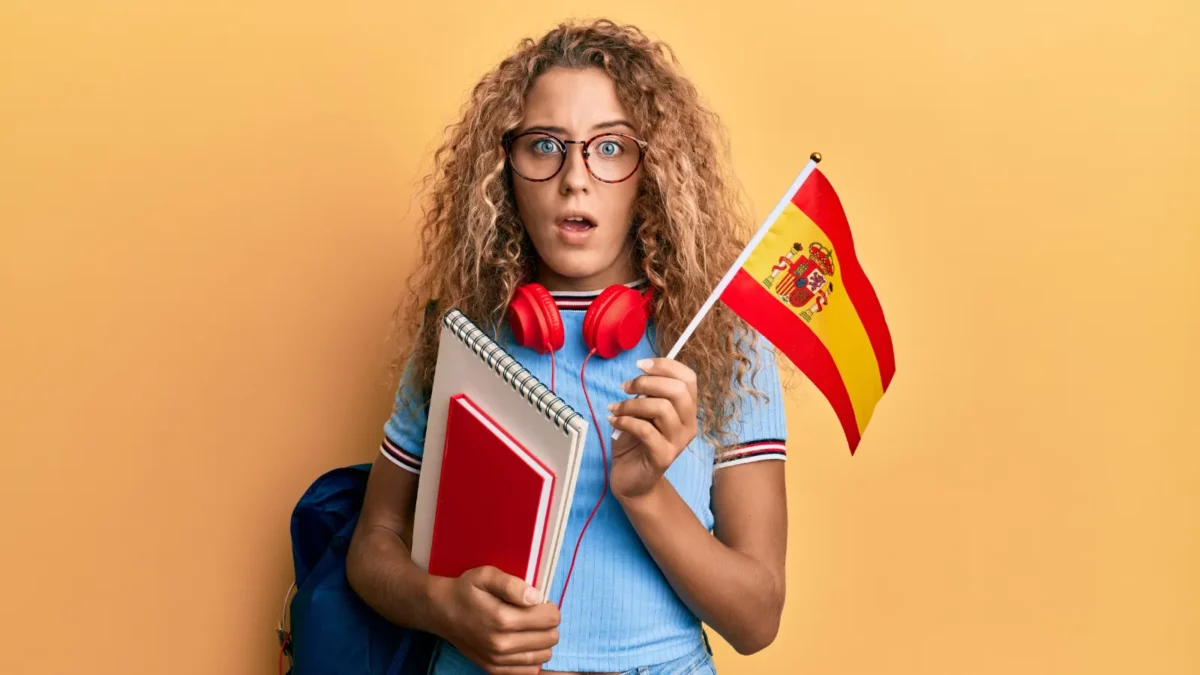 Woman with Spain flag looking surprised