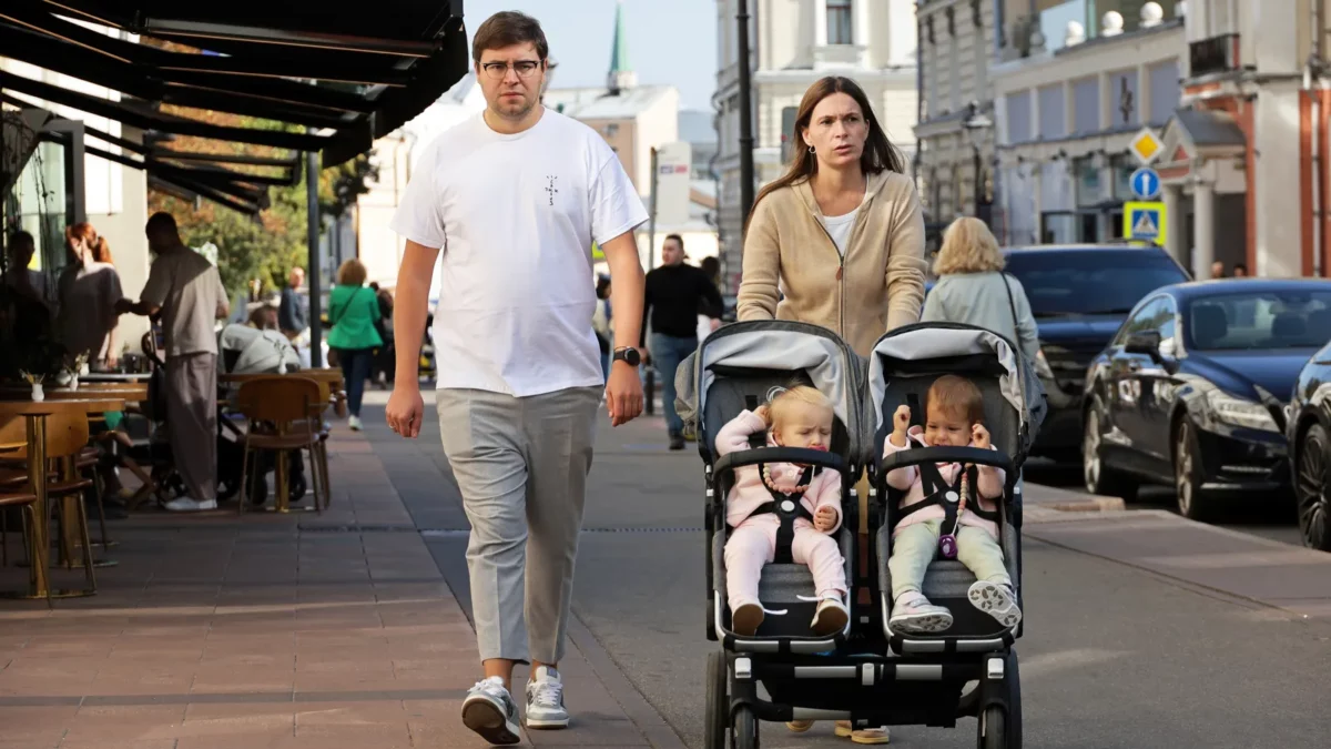 Couple with a baby stroller