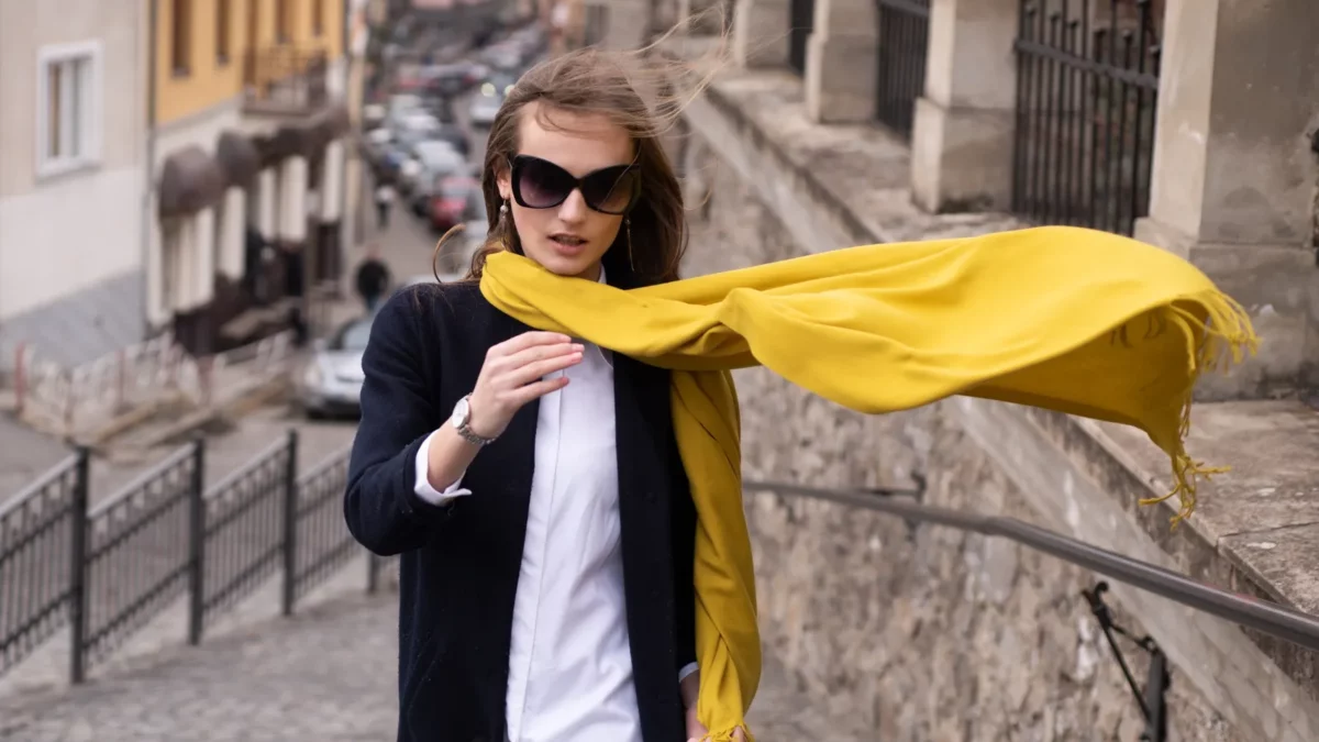 Fashionable woman with yellow scarf