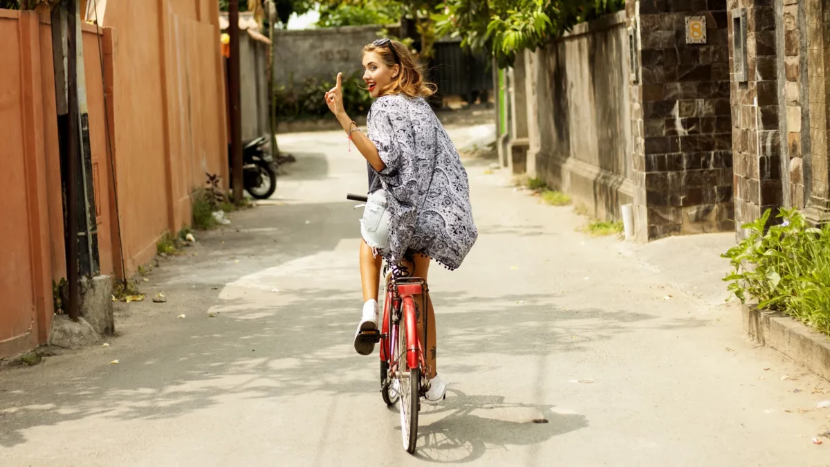 Floral outfit girl on bicycle