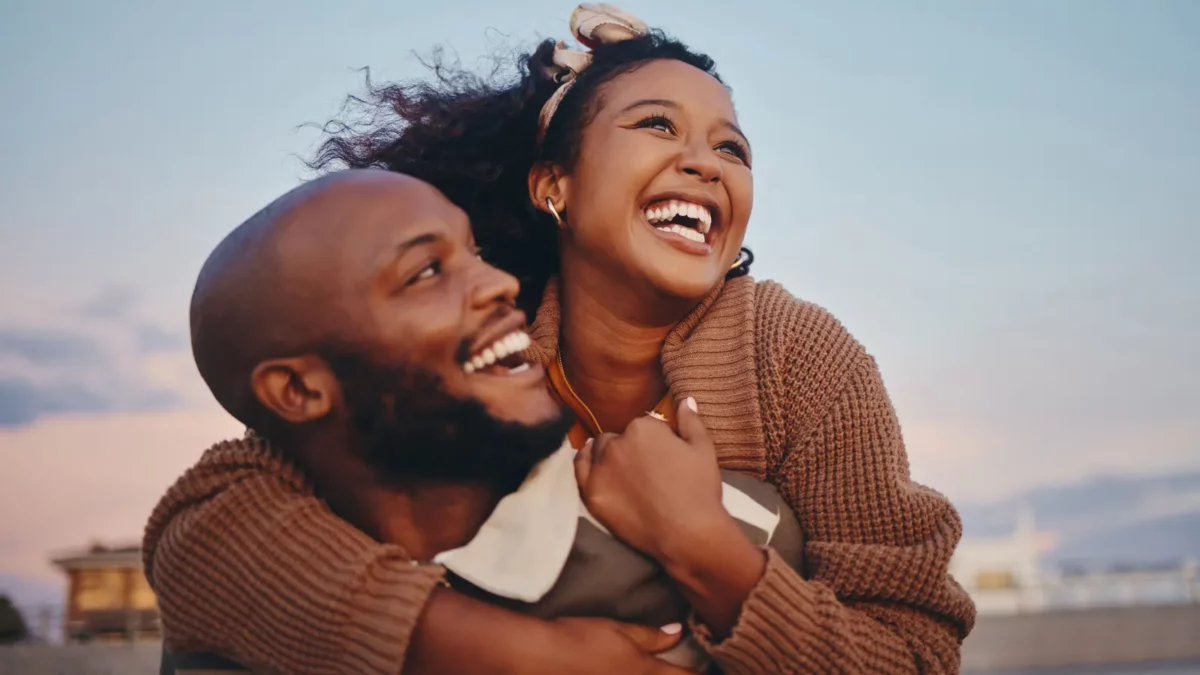 Happy black couple laughing