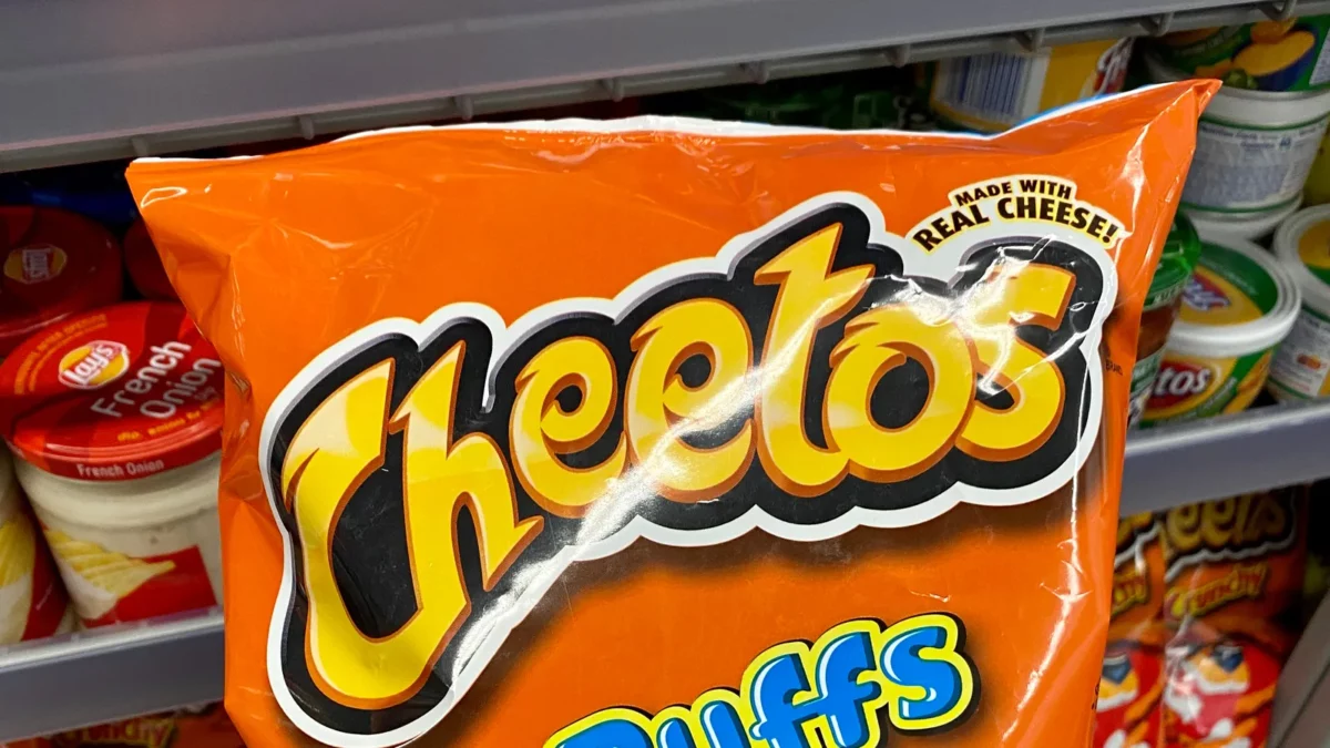 Holding a bag of cheetos