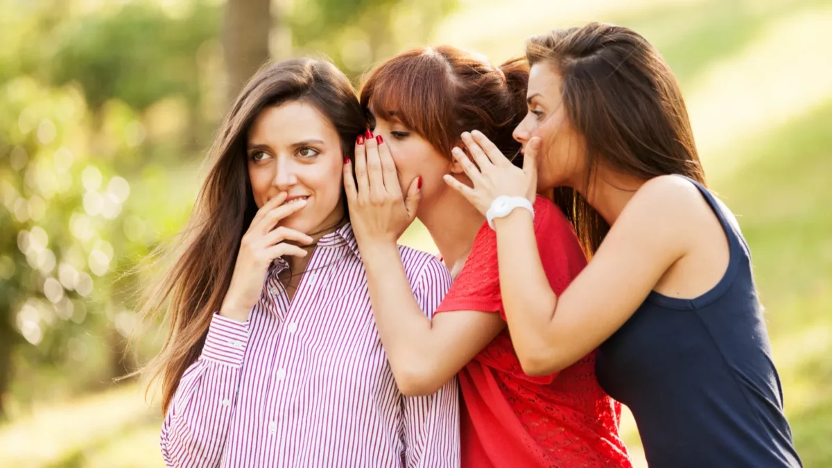 Three whispering women