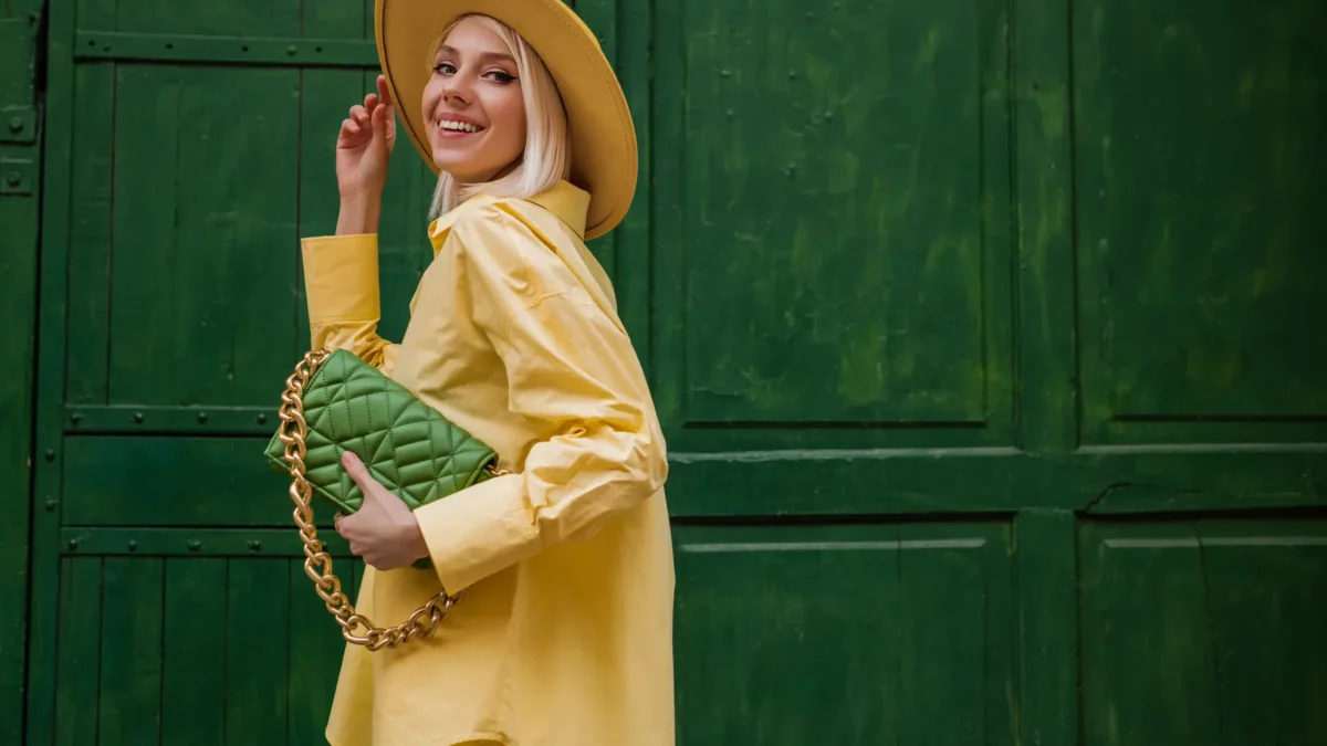 Joyful smiling woman wearing yellow outfit