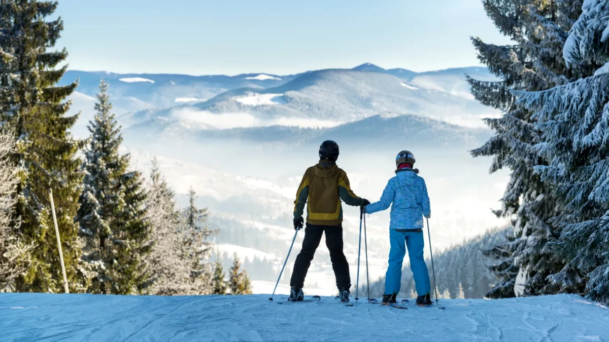 Skiers enjoying beautiful mountain landscape in winter