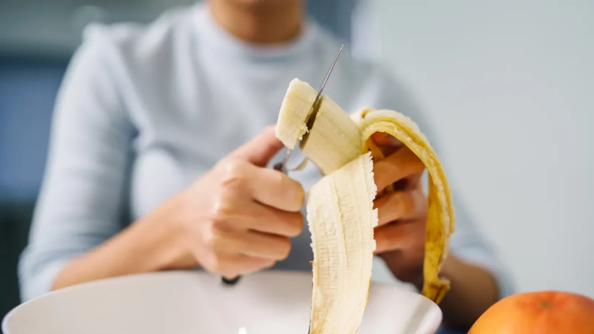 Woman preparing banana