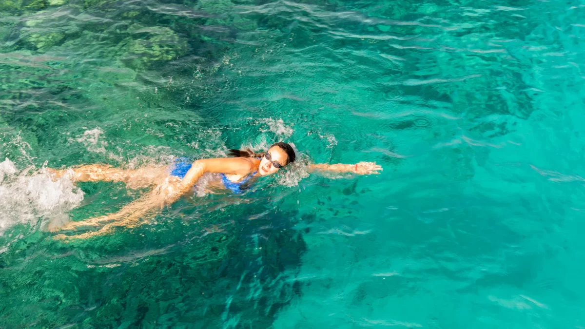 Woman swimmer swimming crawl in the sea