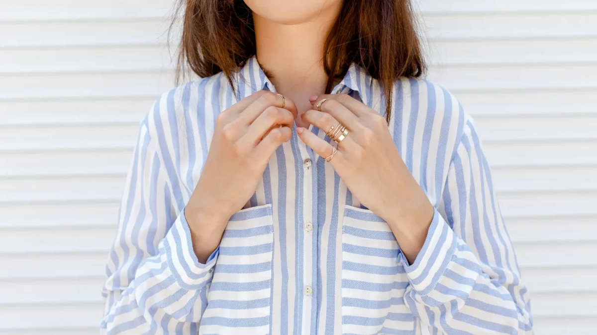 Woman wearing blue striped button down shirt