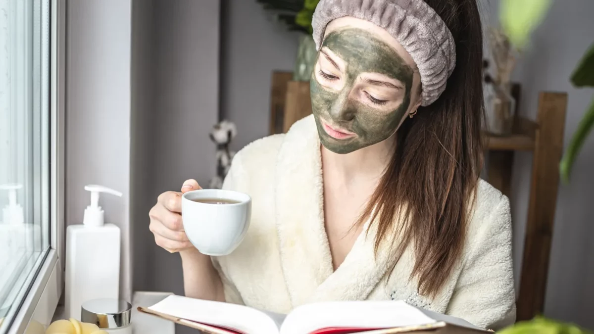 Woman with a green face mask.webp