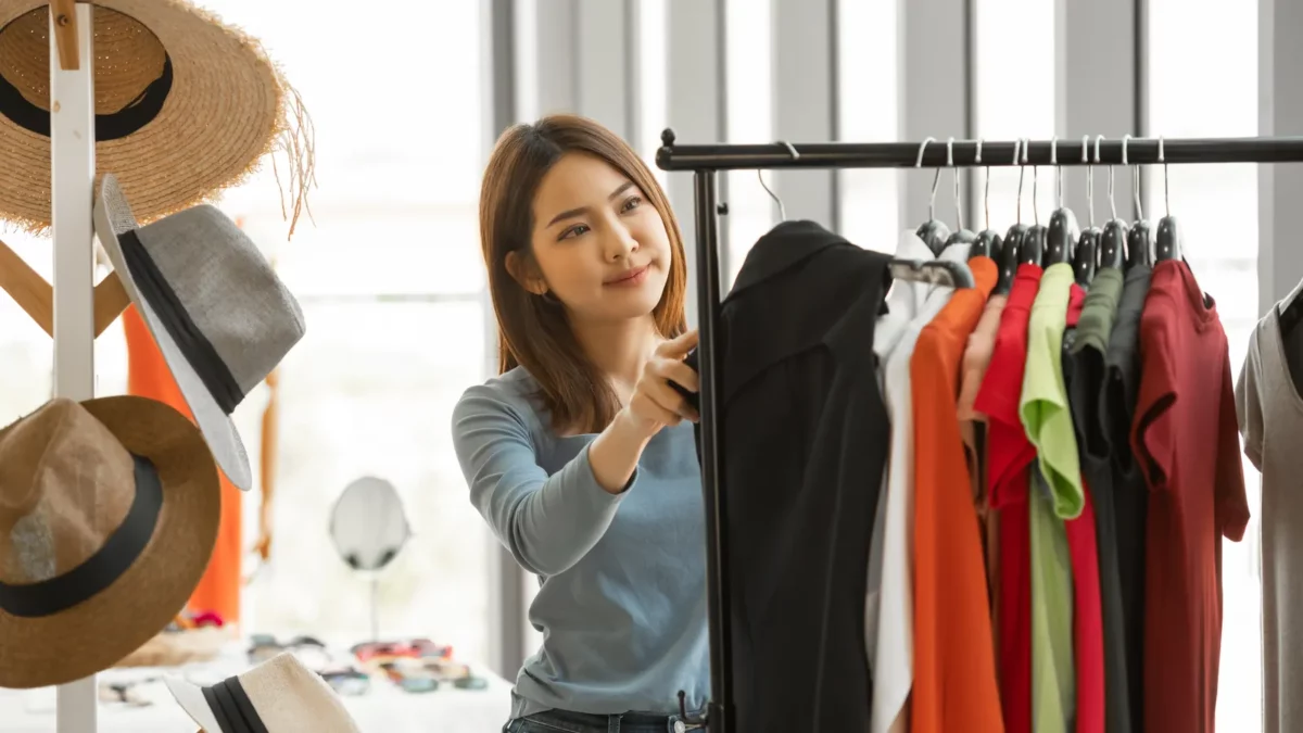 Young asian woman choosing cloths