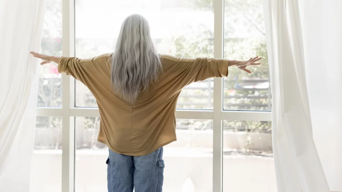 Senior woman with long naturally grey hair