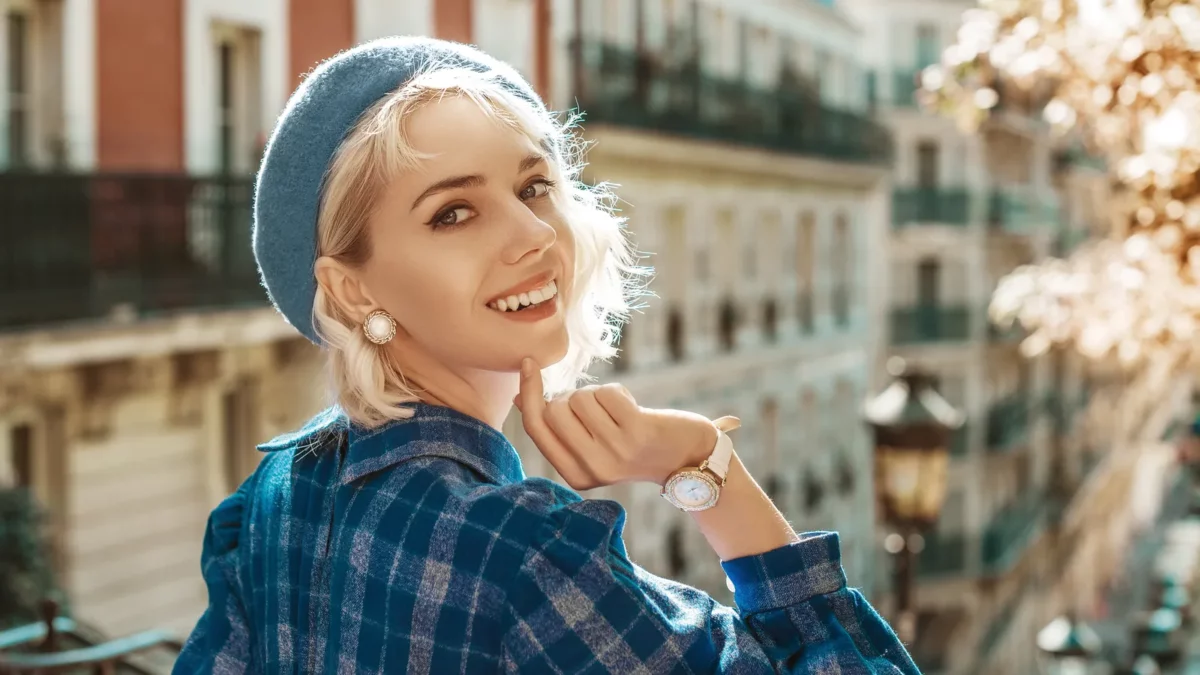 Smiling woman wearing stylish autumn blue checkered dress